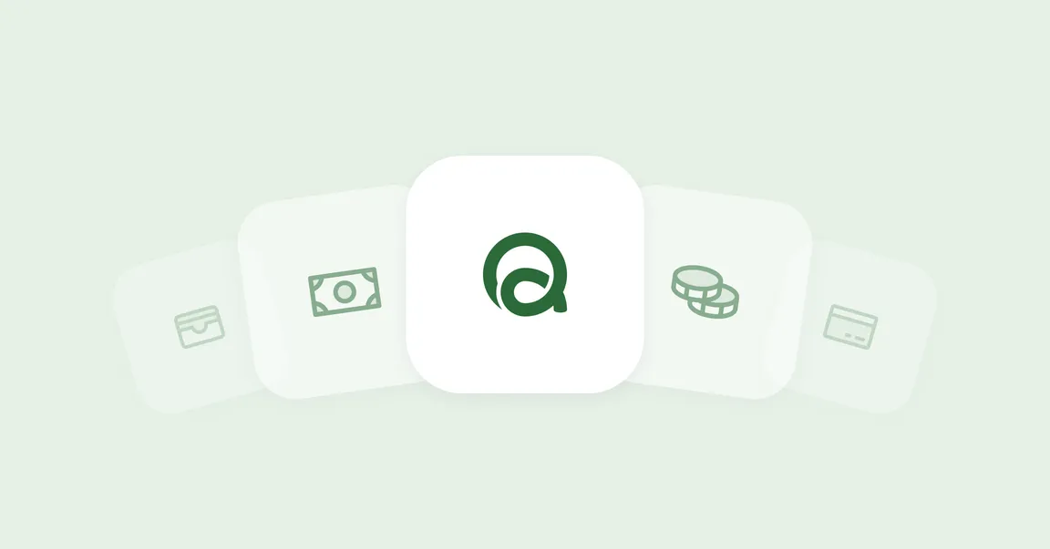 The Quidough mark on a white tile, between a wallet, a banknote, coins and a card.
